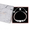 Silver Plated Charm Braclet With Pink Plait Strap - Gift Boxed